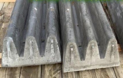 The ends of two finished cement cattle guards.
