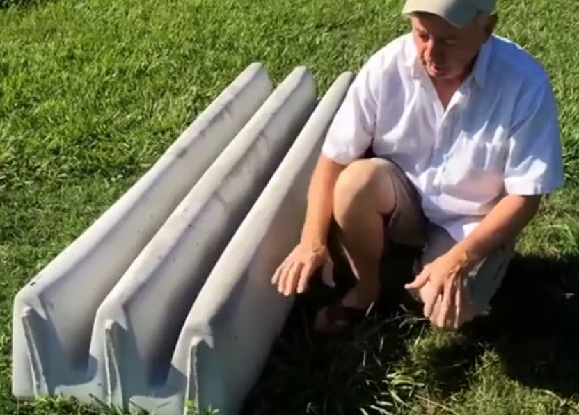 A finished cattle guard on the grass.