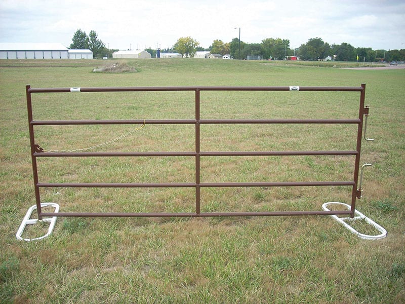 Livestock gate on a stand in the grass