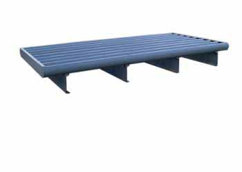 A cattle guard with round top rails and c-channel designed for heavy loads.