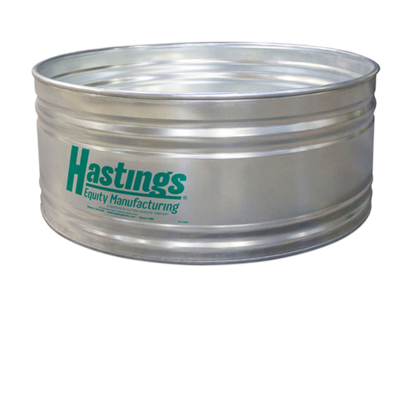 A large, round galvanized stock tank.